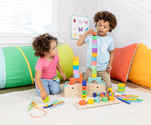 children playing with colorful blocks